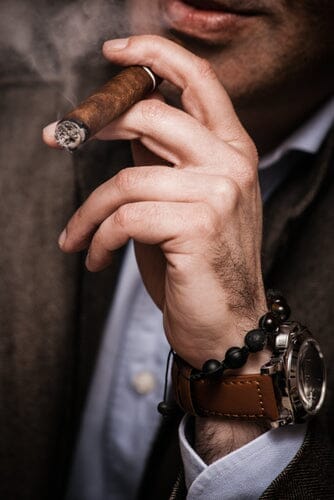man smoking a cigar