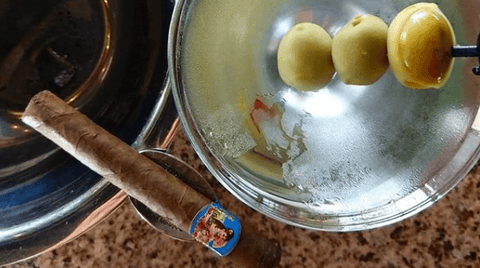 Cigar next to a martini