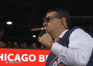 coach smoking a cigar